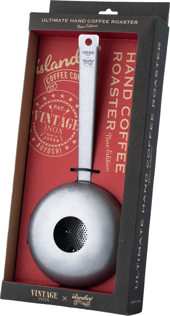 専用ボックスに入ったULTIMATE HAND COFFEE ROASTER New Edition。赤い台紙にislanders' Coffee CompanyとVINTAGE INOXのロゴ、黒い外箱に製品名